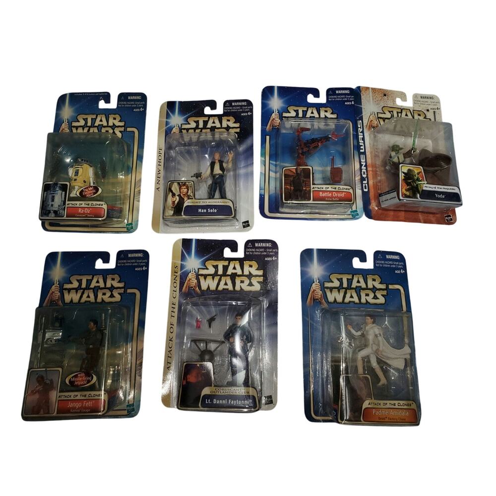 Collection of Vintage Star Wars Action Figures from the early 2000s unopened